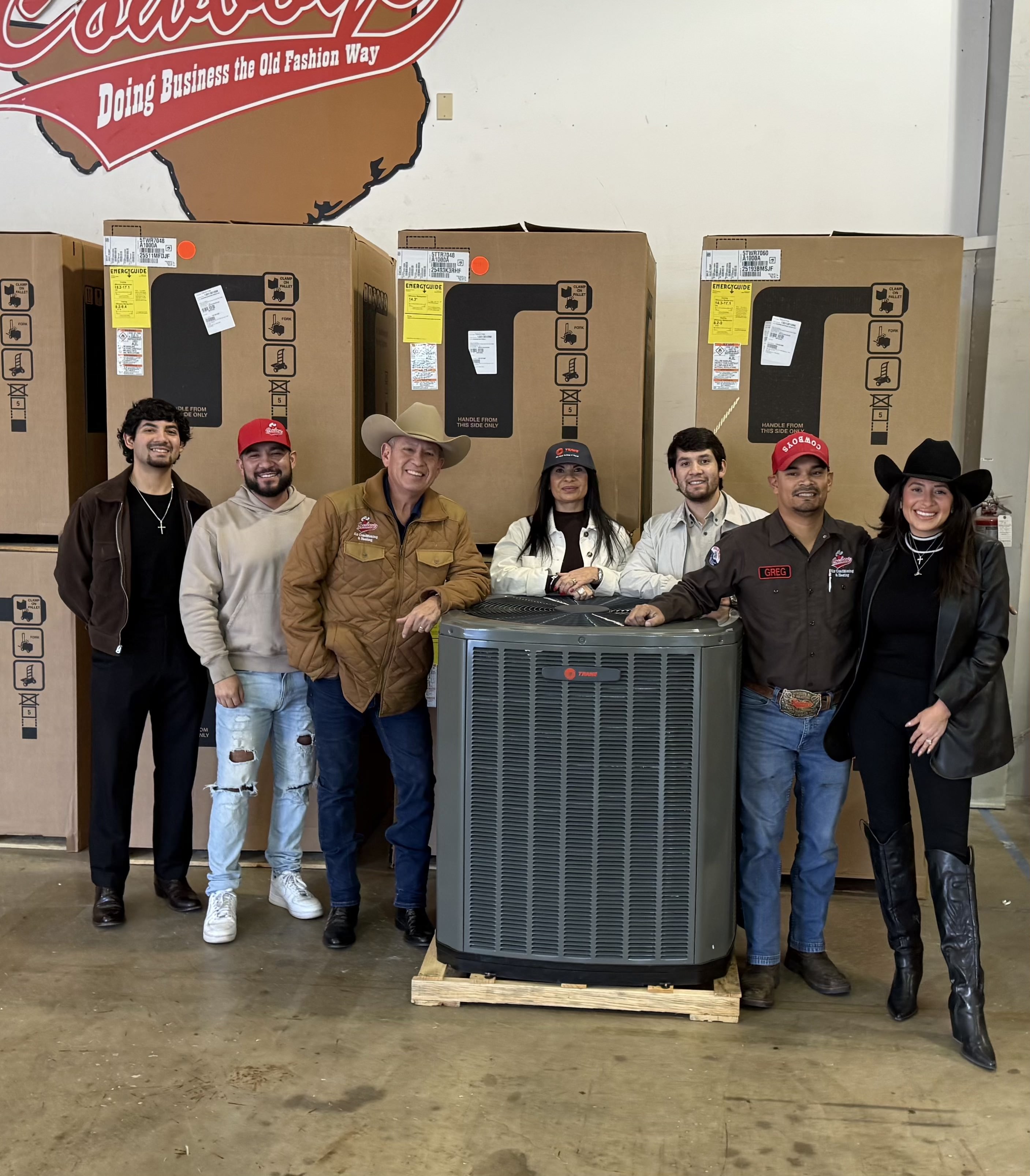 The Martinez family around a Trane unit