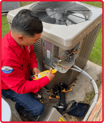 Tech servicing AC unit