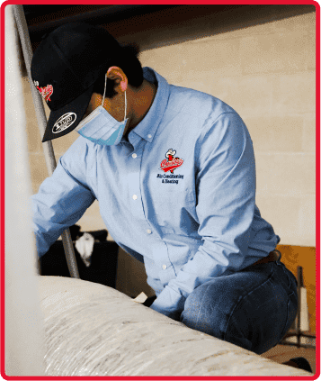 Tech working on air duct