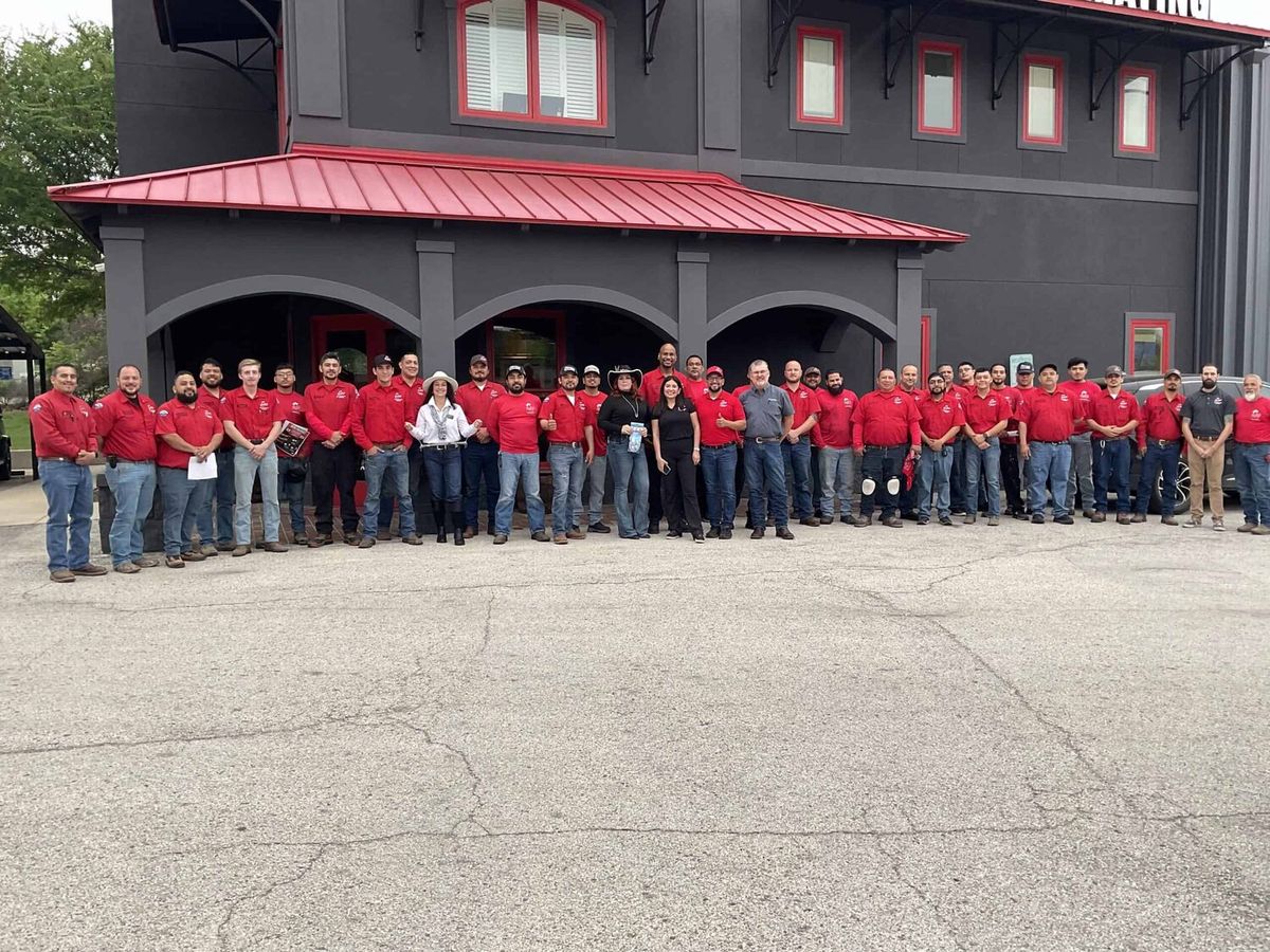 The Cowboys AC crew in front of the San Antonio shop