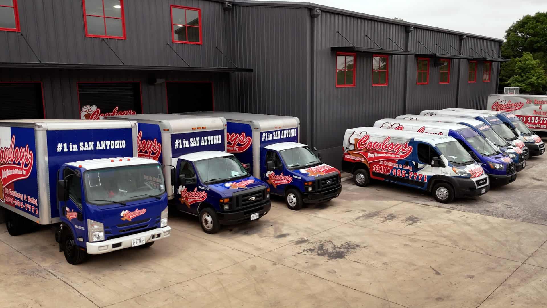 The Cowboy's fleet lined up at the shop, every truck marked #1 in San Antonio