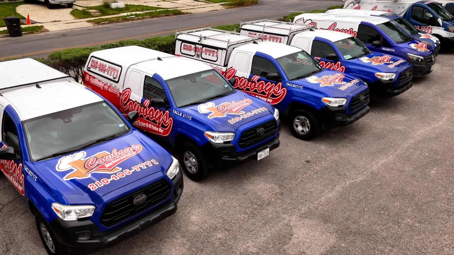 A row of Cowboy's service trucks lined up and ready to roll