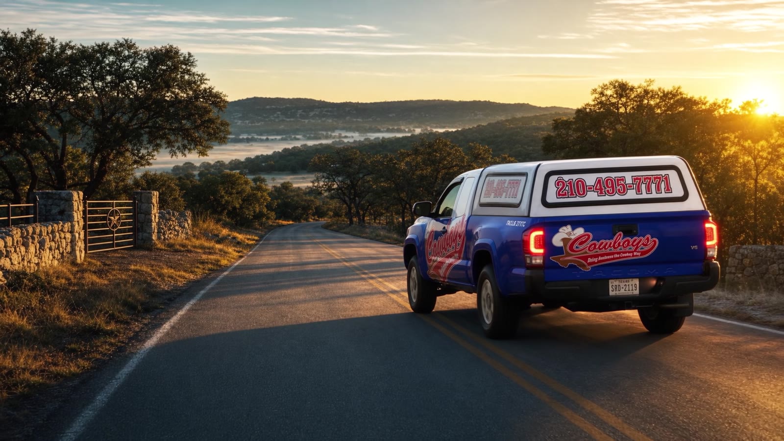 A Cowboy's truck heading out a Hill Country ranch road at sunrise