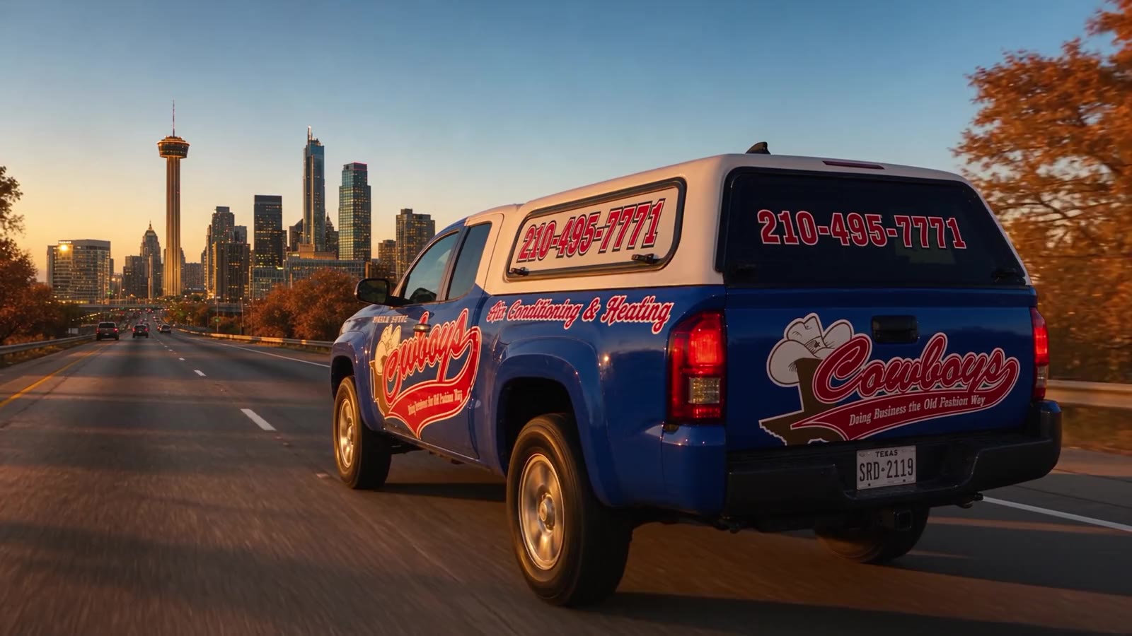 A Cowboy's Air Conditioning & Heating truck heading into downtown San Antonio, pulling up to the Cowboy's shop, then a customer's driveway