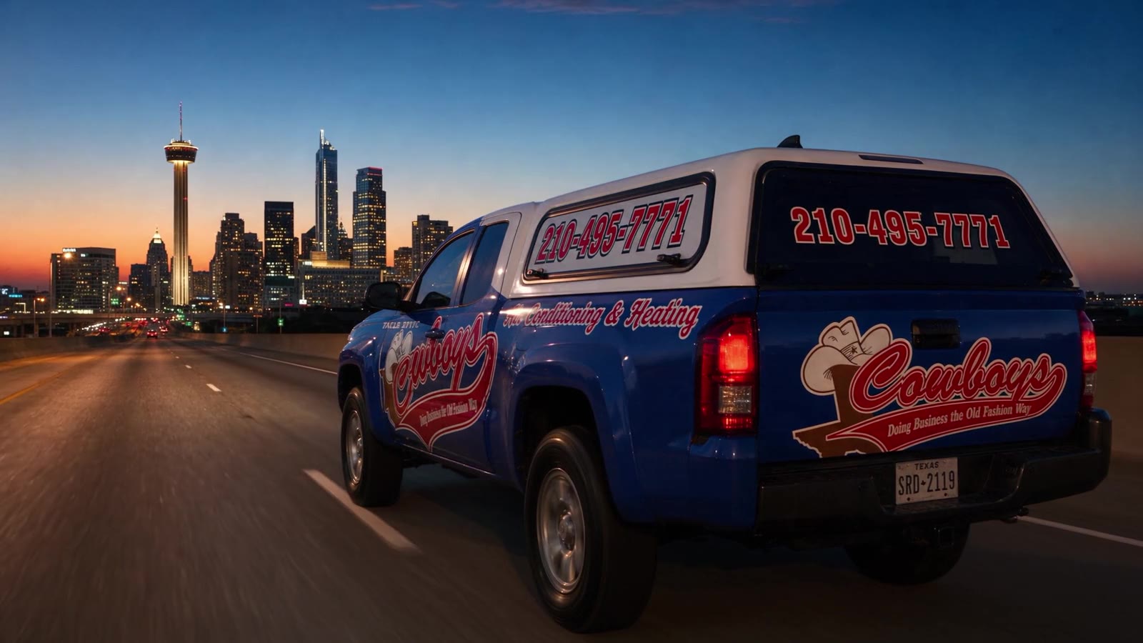 A Cowboy's Air Conditioning & Heating truck heading into downtown San Antonio at dusk, pulling up to the Cowboy's shop, then a customer's driveway